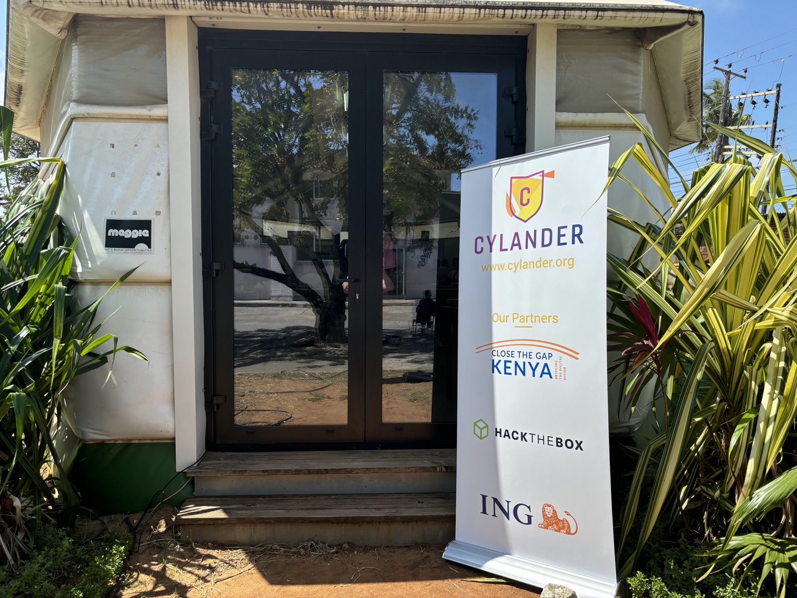 Cylander banner with partner logos at the course venue in Mombasa